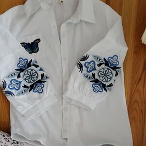 White Shirt with Blue Embroidery and Butterfly Detail